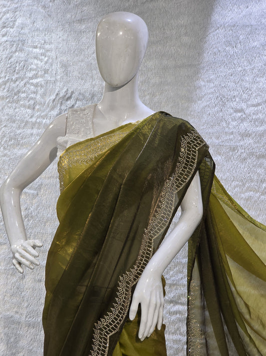 A contemporary neon and bottle green pure satin silk saree featuring a plain body paired with a heavy stone-work necklace border, creating a stunning contrast. The rich border detailing adds a designer edge, while the running blouse maintains a coordinated look. This saree is perfect for pre-wedding functions, mehendi events, and fashionable festive wear.