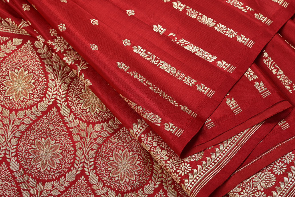 Red fabric with gold floral patterns