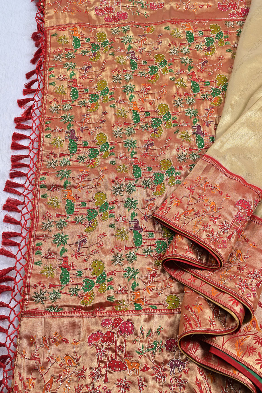 Silk rani colour tissue silk saree for weddings and festive occasions
