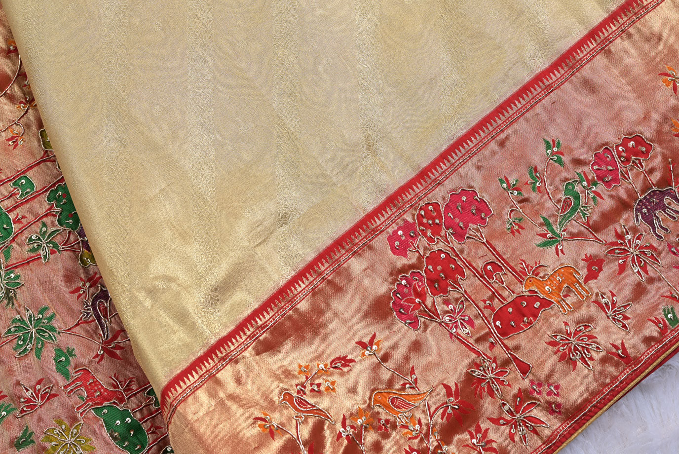 Silk rani colour tissue silk saree for weddings and festive occasions