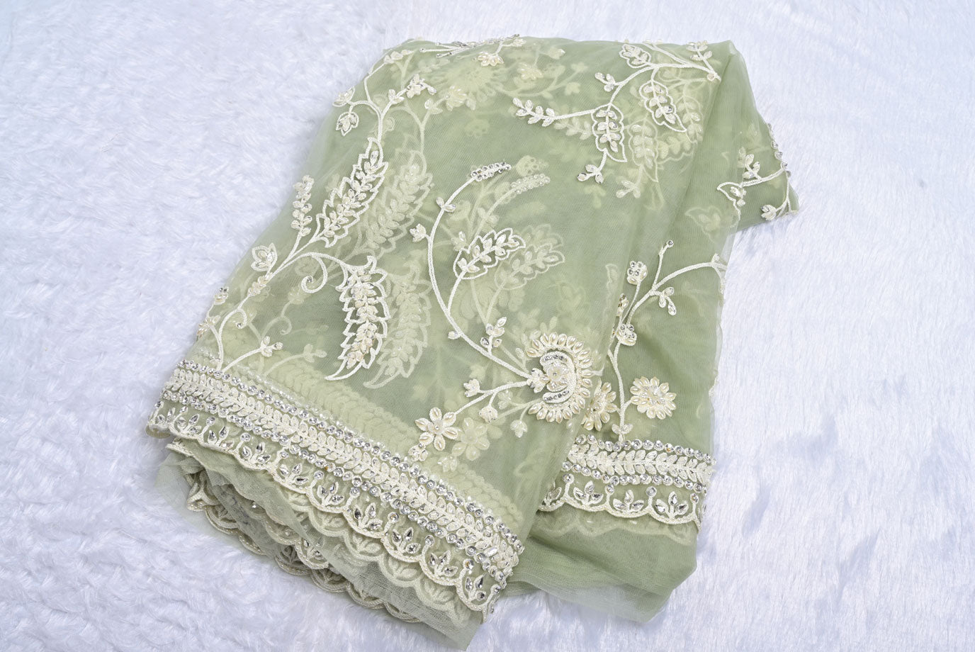 Fabric pista green net designer saree for weddings and festive occasions