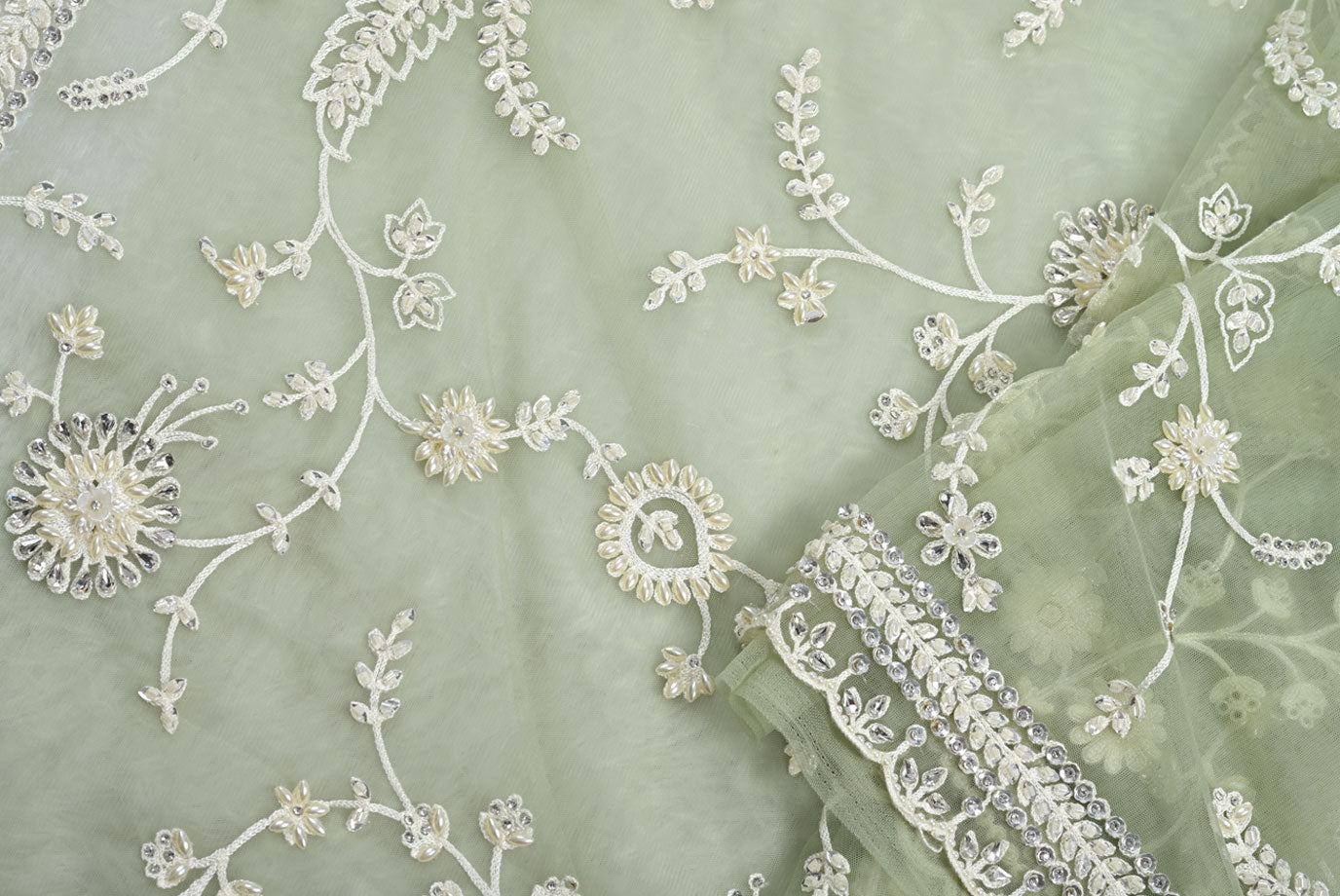 Fabric pista green net designer saree for weddings and festive occasions
