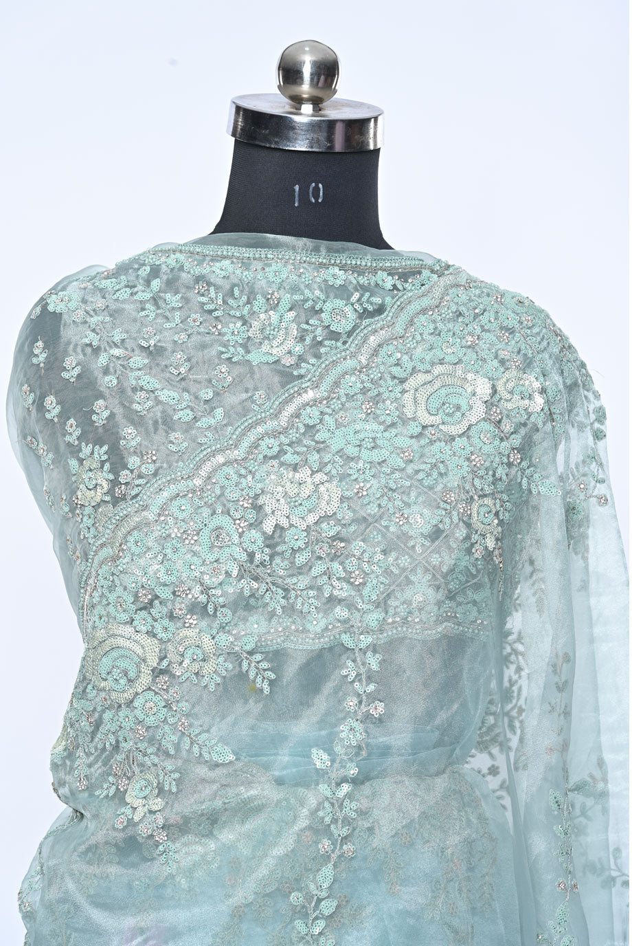 Fabric light pista organza saree for weddings and festive occasions