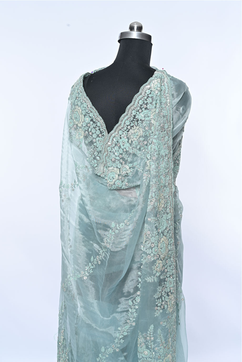 Fabric light pista organza saree for weddings and festive occasions