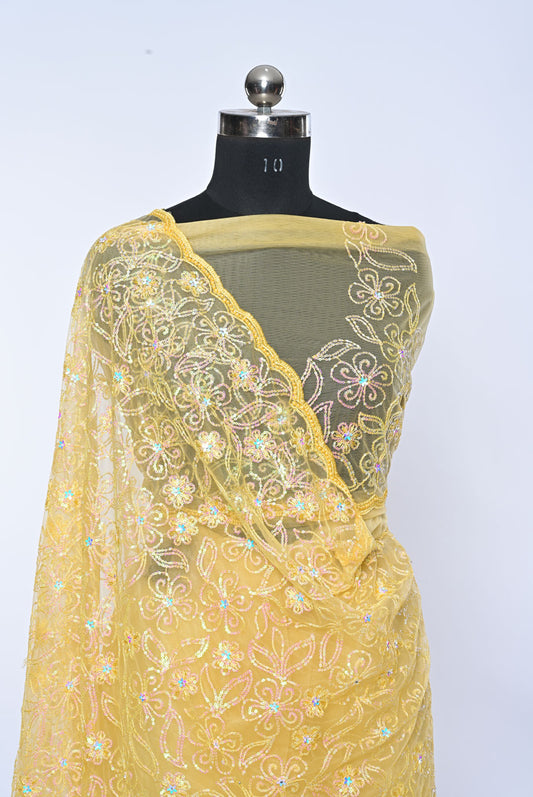 Yellow embroidered saree on a mannequin against a white Fabric yellow net designer saree for weddings and festive occasions background