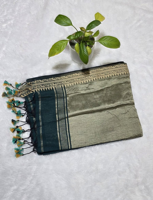 Soft bottle green cotton saree with elegant border finish and beautiful zari pallu with tessels at border.Perfect for daily wear and festivals