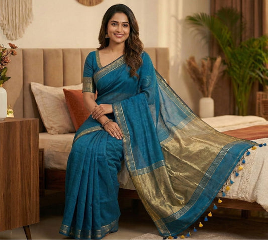 Blue pure cotton saree featuring plain base design, beige zari pallu weaving, simple border and contrast blouse perfect for casual wear.