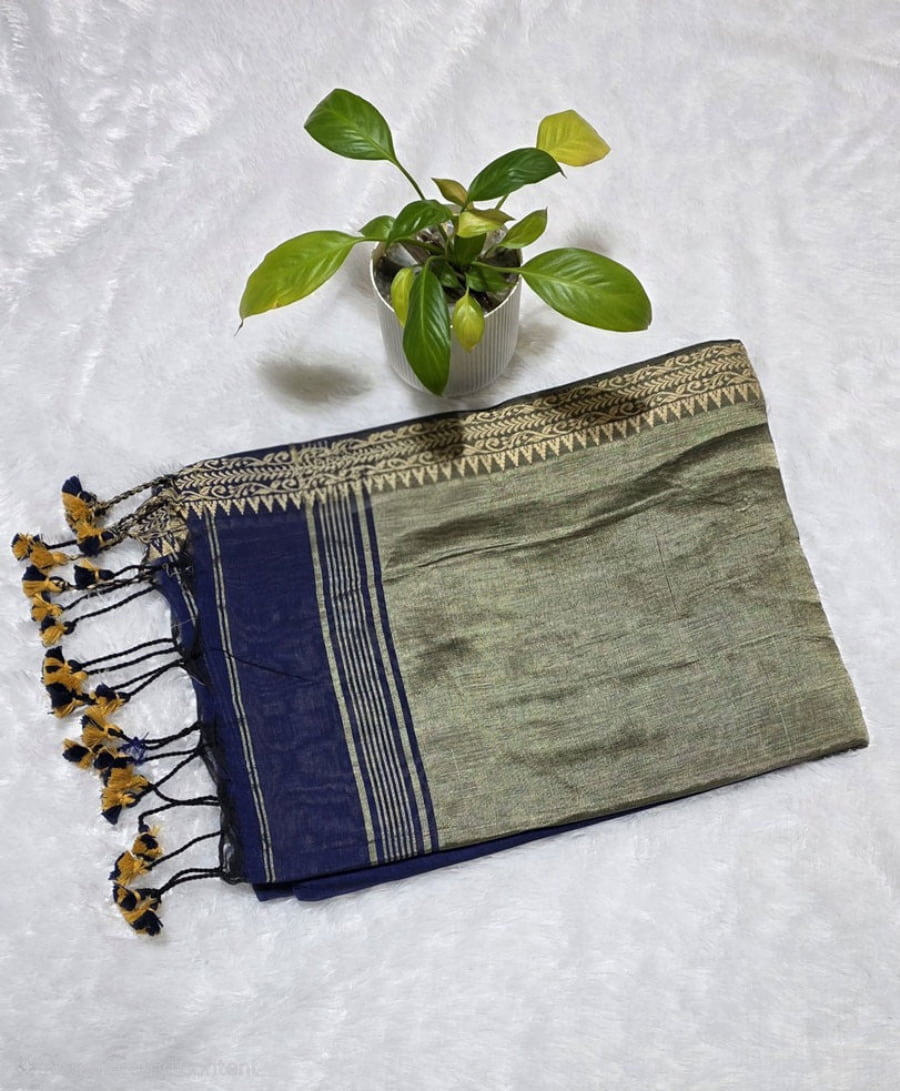 Festive navy blue pure cotton saree with intricate butti pattern, copper zari pallu, and simple golden border detailing.
