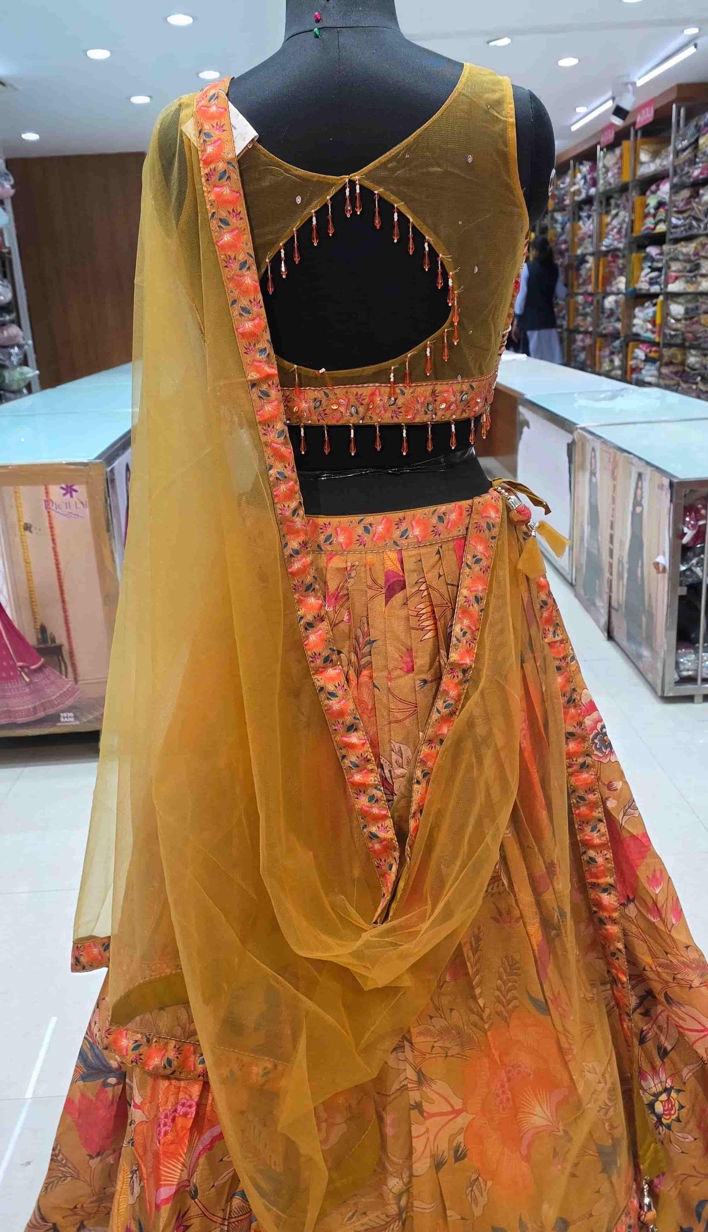 Flowy mustard lehenga skirt featuring vibrant floral digital print design.