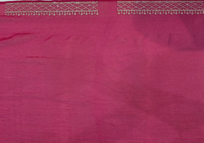 A luxurious baby pink pure satin silk saree adorned with delicate overall small stone work that gives a subtle festive sparkle. The saree is elevated with a contrast dark pink border, embellished with matching stone handwork, adding richness and definition to the drape. Paired with a dark pink contrast blouse, this saree is perfect for weddings, receptions, and special gatherings where timeless elegance is desired.