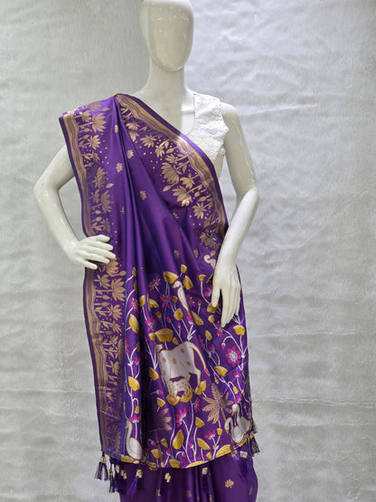 A rich tana silk paithani saree featuring evenly spaced lotus buttis woven in golden zari. The floral lotus border and traditional rich pallu elevate its classic charm. Comes with a self blouse for a graceful traditional look.
