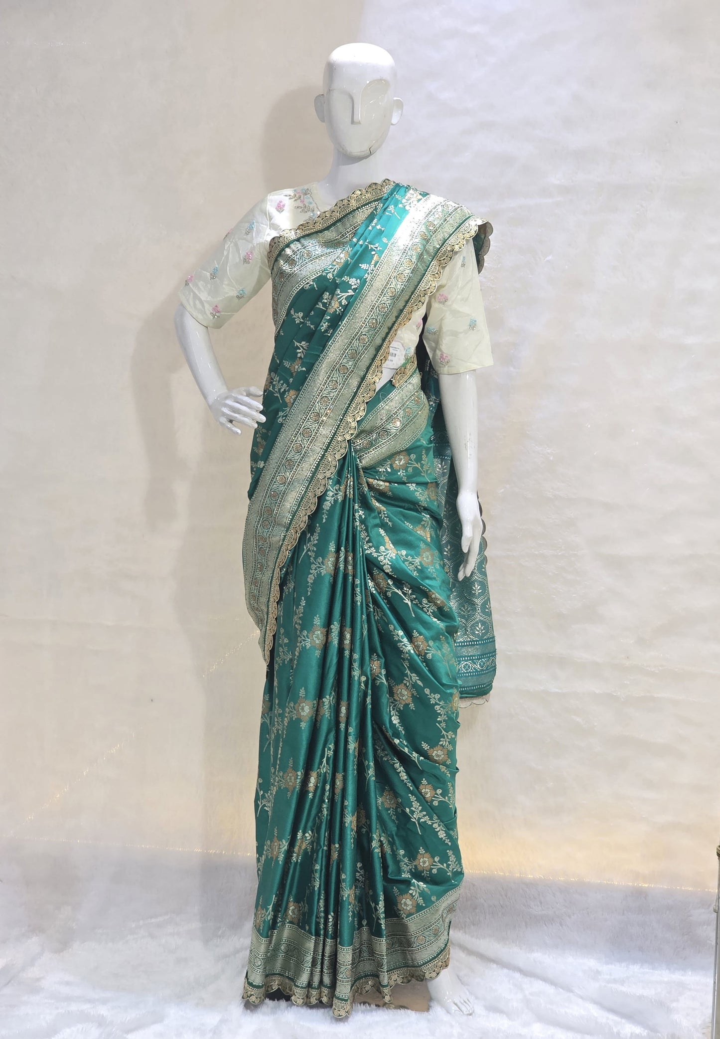 A rich semi-designer Banarasi saree with intricate veil artistry and silver zari highlights. Traditional grace for grand occasions.