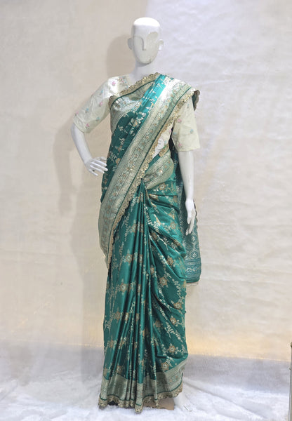 A rich semi-designer Banarasi saree with intricate veil artistry and silver zari highlights. Traditional grace for grand occasions.