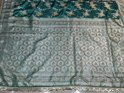 A rich semi-designer Banarasi saree with intricate veil artistry and silver zari highlights. Traditional grace for grand occasions.