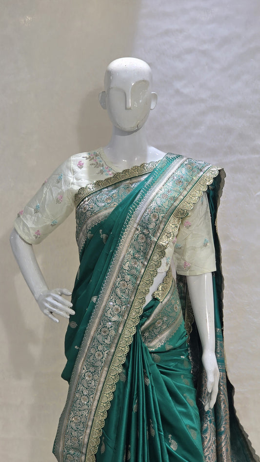A graceful green saree with rich zari craftsmanship — perfect for festive and cultural events.