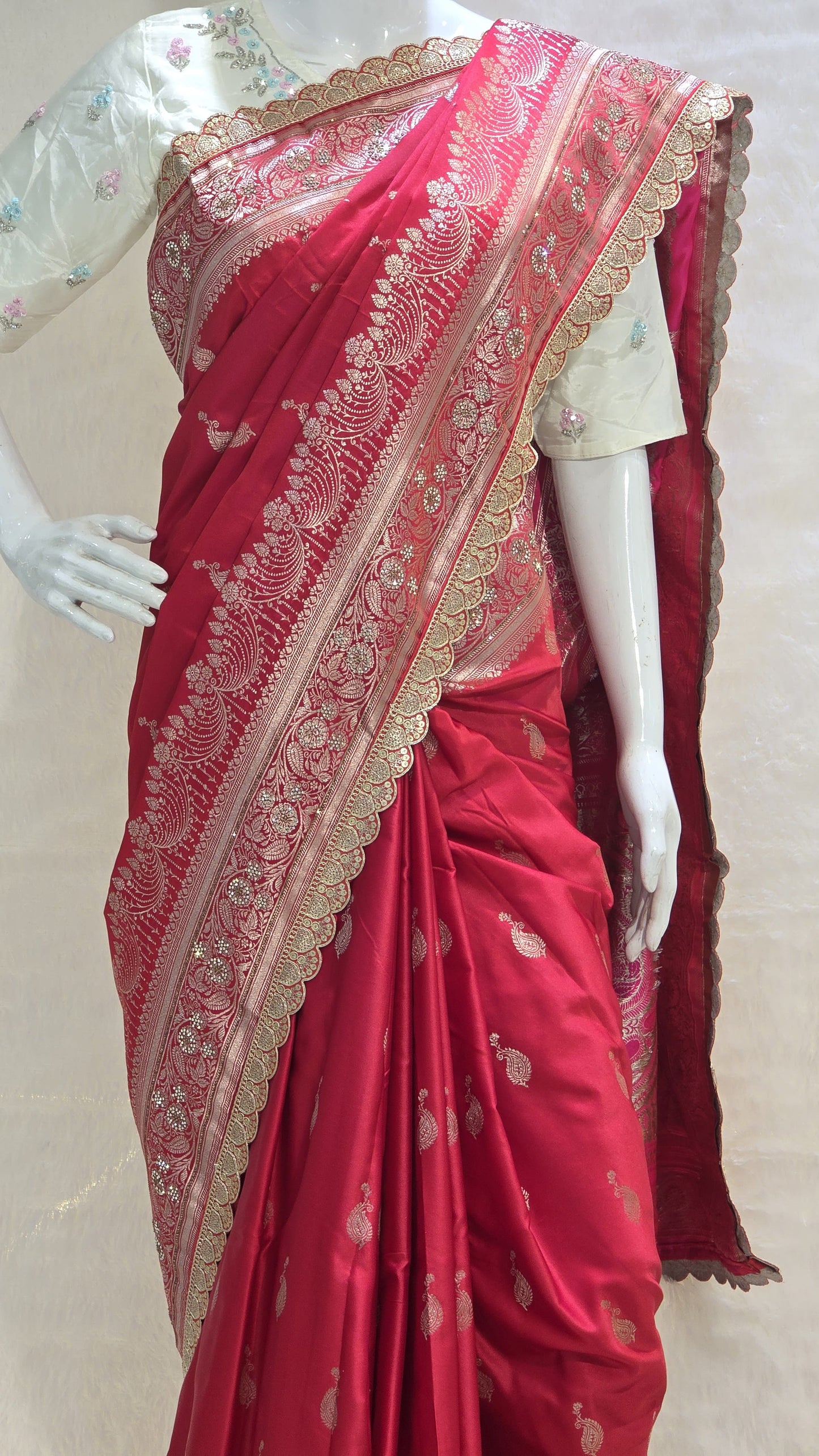 Radiant red Banarasi saree with silver zari motifs that add timeless ethnic beauty. A perfect pick for bridal trousseau and festive nights.