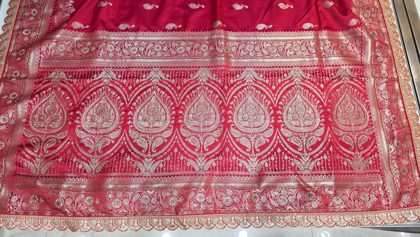 Radiant red Banarasi saree with silver zari motifs that add timeless ethnic beauty. A perfect pick for bridal trousseau and festive nights.