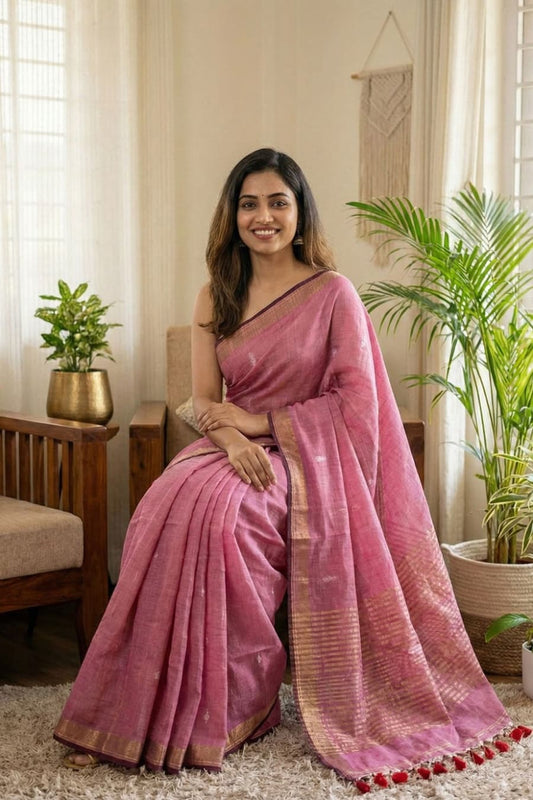 Baby pink pure cotton saree featuring all-over silver butti work, golden line stripe pallu design and golden border
