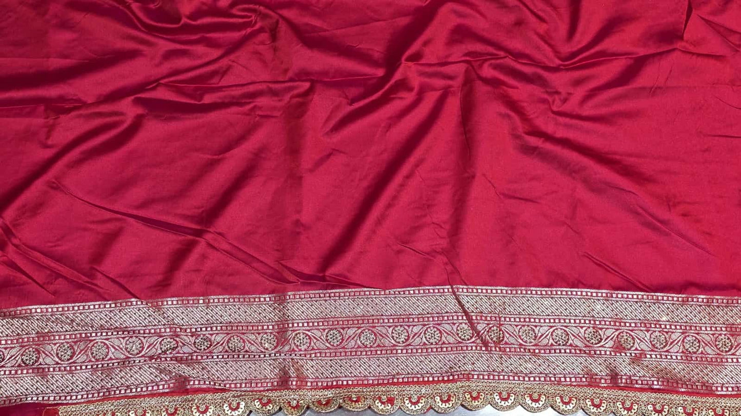 Festive red Banarasi saree featuring artistic veil pattern and silver zari