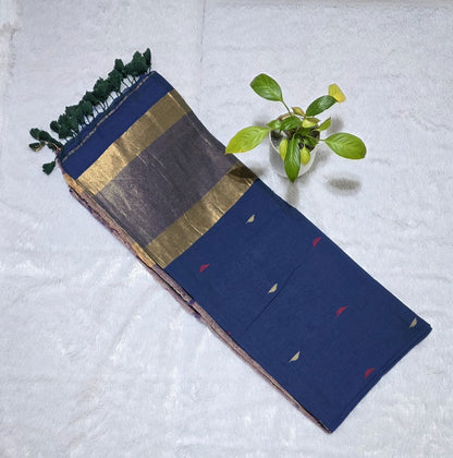 Navy blue cotton saree with small colourful triangle butties, copper zari pallu weaving and minimal golden border with tassels.For office wear and daily wear .