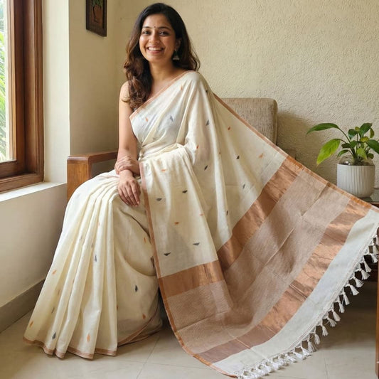 White pure cotton saree featuring colourful triangle butti weaving, copper zari pallu and minimal golden border with tassels