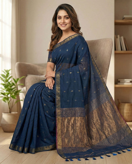 Indigo blue cotton saree with copper zari butties and zari pallu .perfect for all day and office wear.