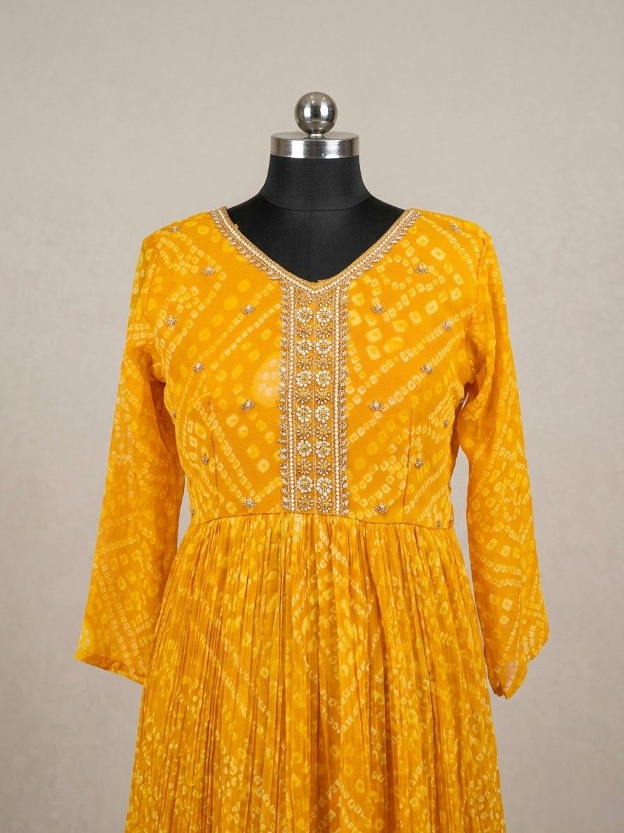 Festive yellow Anarkali dress with embroidery and flowy silhouette