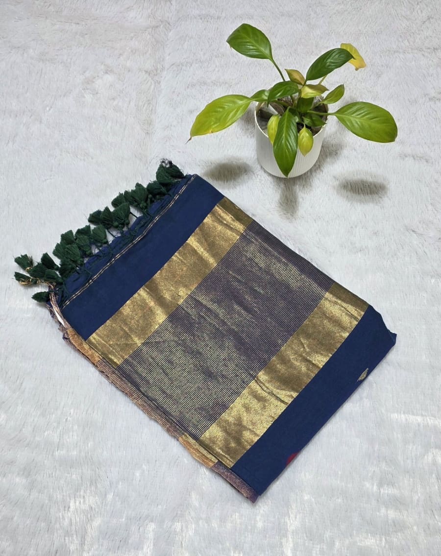Navy blue cotton saree with small colourful triangle butties, copper zari pallu weaving and minimal golden border with tassels.For office wear and daily wear .