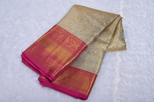 Cream Pure Tissue Silk Saree with Fancy Self Design and Contrast Border