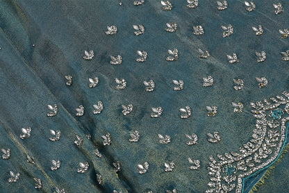 Silk pecock green tissue silk saree for weddings and festive occasions