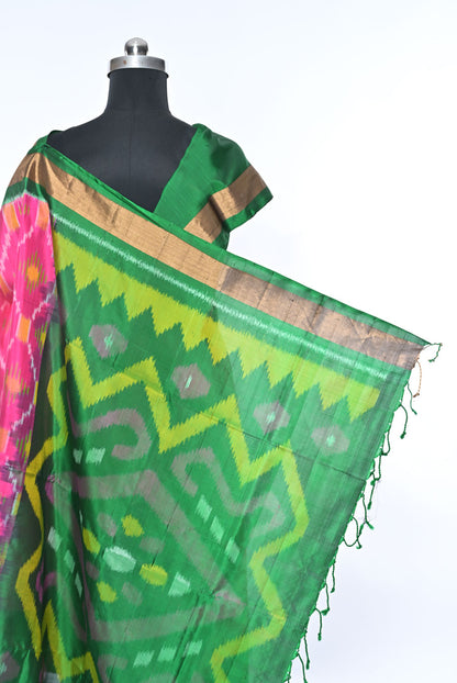 Green saree with pink and yellow patterns on a mannequin against a white background  green colour pure soft silk saree for weddings and festive occasions