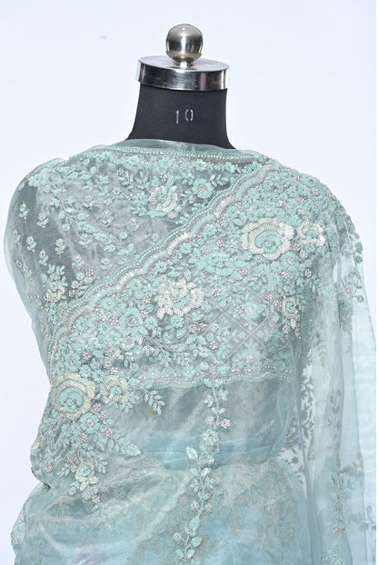 Fabric light pista organza saree for weddings and festive occasions