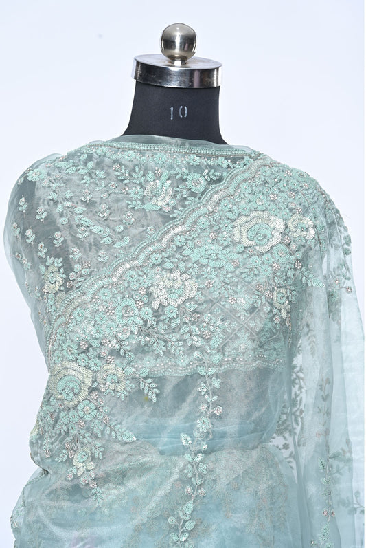 Fabric light pista organza saree for weddings and festive occasions