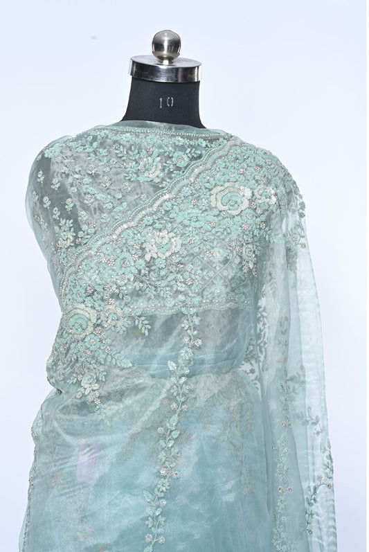 Fabric light pista organza saree for weddings and festive occasions