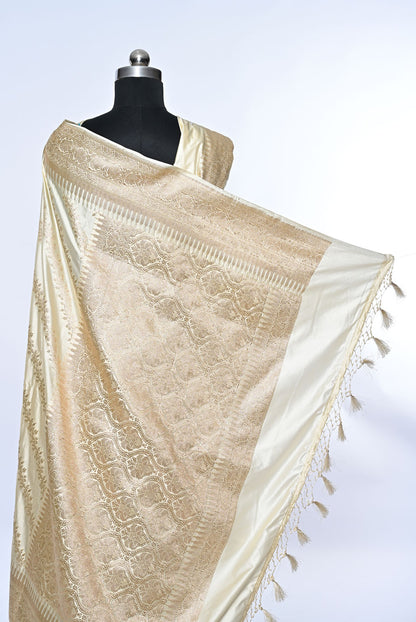 Half white Banarasi soft silk saree with golden zari sequence veil design and golden zari border, perfect for weddings and festive occasions.