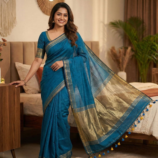 Blue pure cotton saree featuring plain base design, beige zari pallu weaving, simple border and contrast blouse perfect for casual wear.