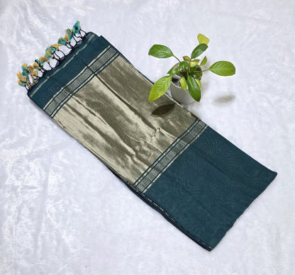 Soft bottle green cotton saree with elegant border finish and beautiful zari pallu with tessels at border.Perfect for daily wear and festivals