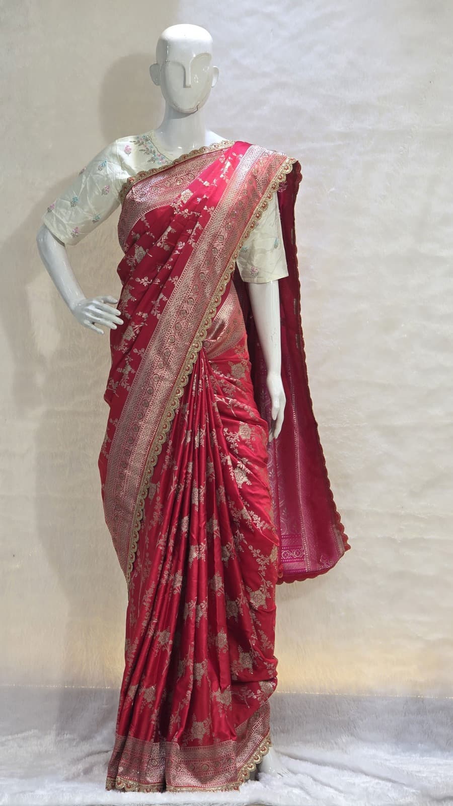 Red Banarasi saree with silver zari and artistic veil design