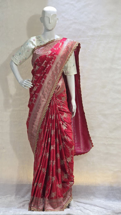 Red Banarasi saree with silver zari and artistic veil design