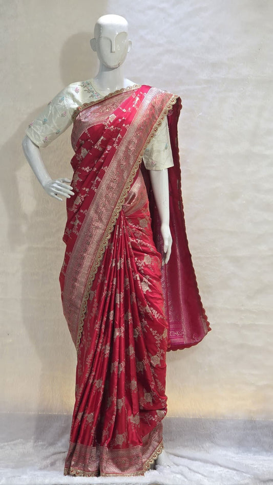 Red Banarasi saree with silver zari and artistic veil design