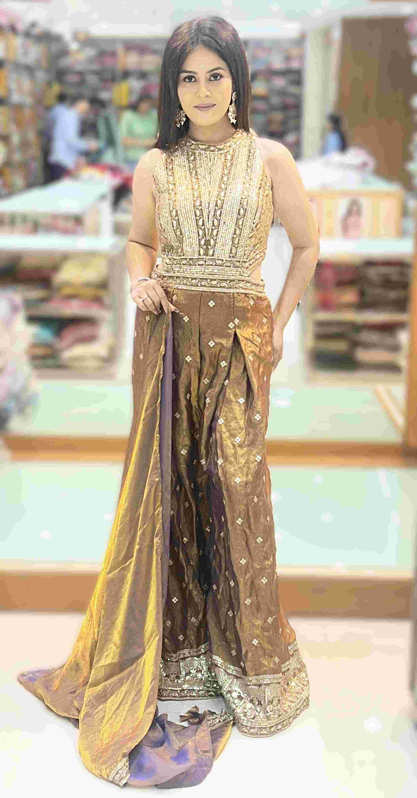 Close-up of antique bronze jumpsuit bodice featuring gold zardosi embroidery, sequins, and mirror-work detailing.