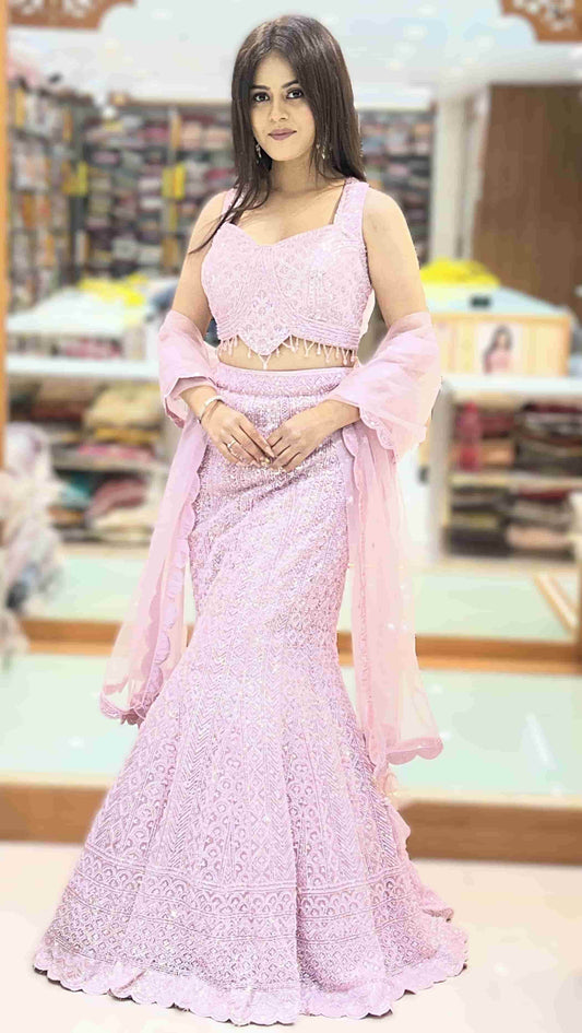Baby pink fishcut lehenga with embellished crop top and mermaid-style skirt front view showcasing elegant silhouette.
