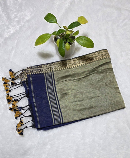 Festive navy blue pure cotton saree with intricate butti pattern, copper zari pallu, and simple golden border detailing.