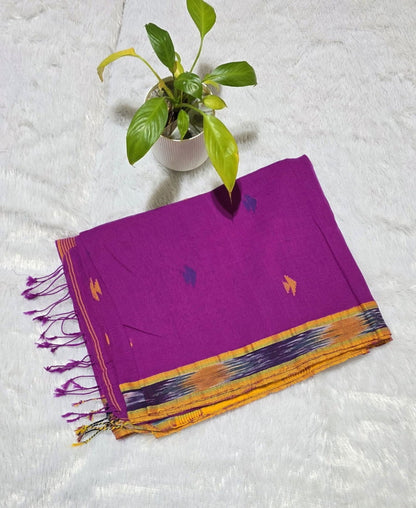 This is a beautiful magenta cloiour cotton saree with overall buties and elegant ikat border weaving paired with beautiful contrast pallu. Ideal for gatherings, daily wear , office wear, family functions and festivals.