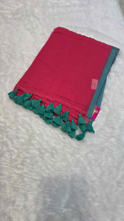 Deep pink mulmul cotton saree with teal green contrast border and tassels