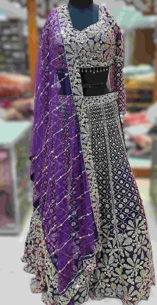 Close-up of royal purple blouse featuring sweetheart V-neckline and intricate sequin embroidery.