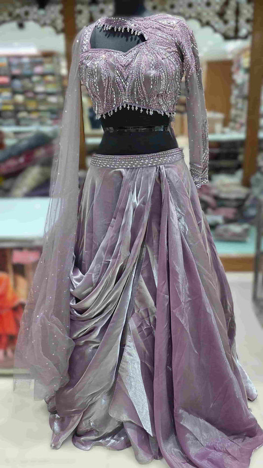 Dusky lilac Indo-Western lehenga set with draped organza skirt and embellished net blouse.