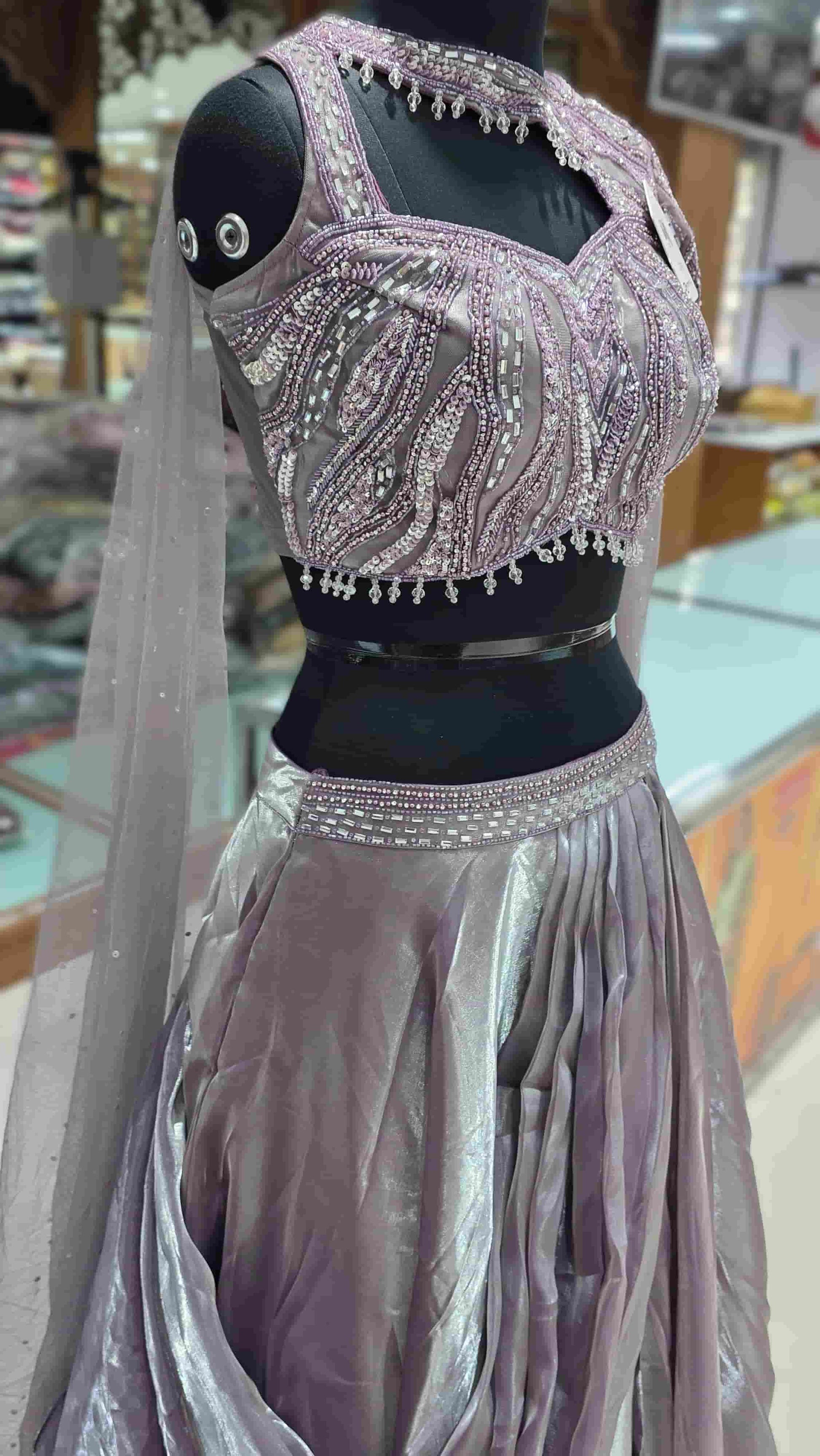 Draped organza lehenga skirt in dusky lilac with soft metallic sheen and pleated layers