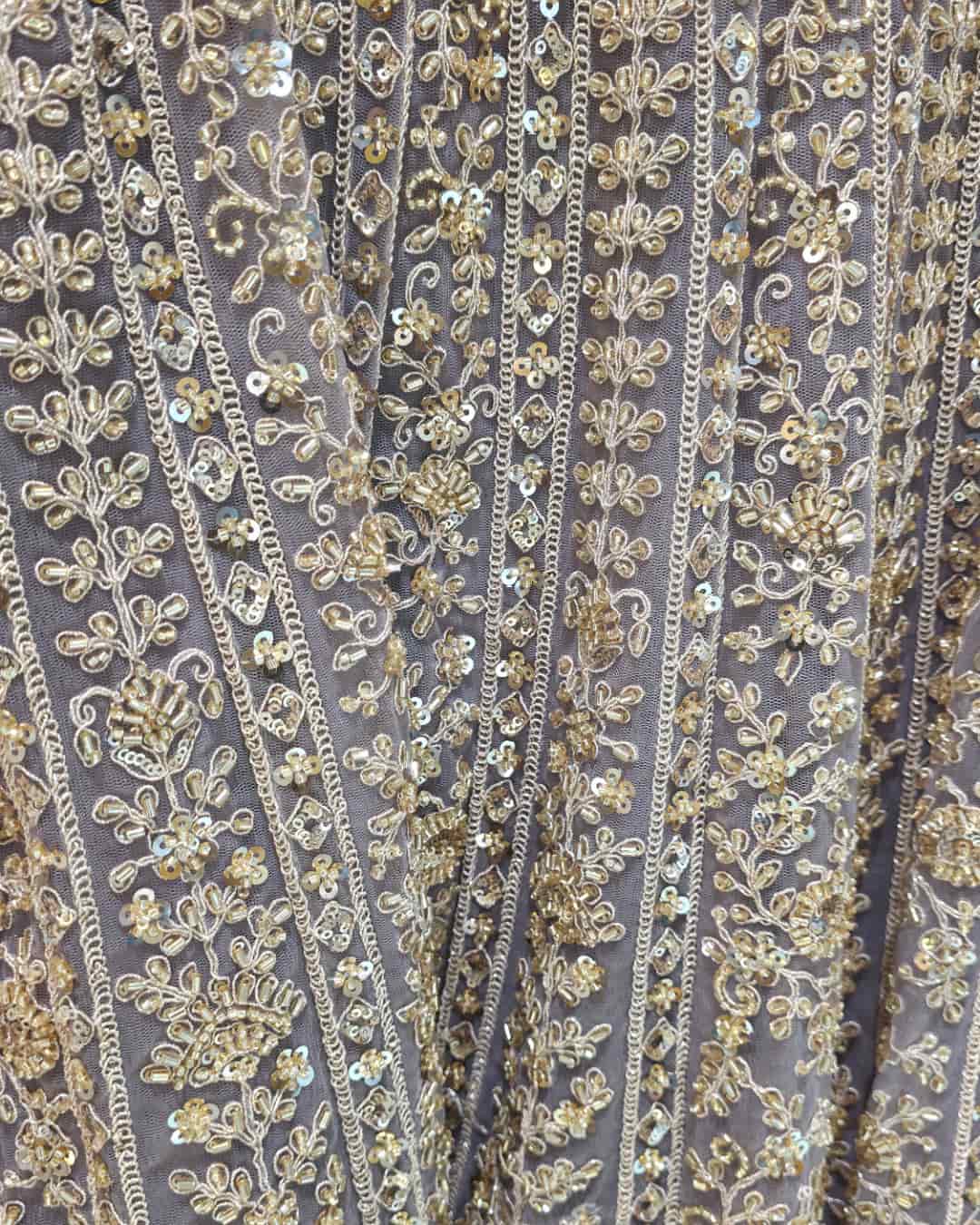 Dusty lavender net dupatta with scalloped embroidered border paired with front cut Anarkali gown.