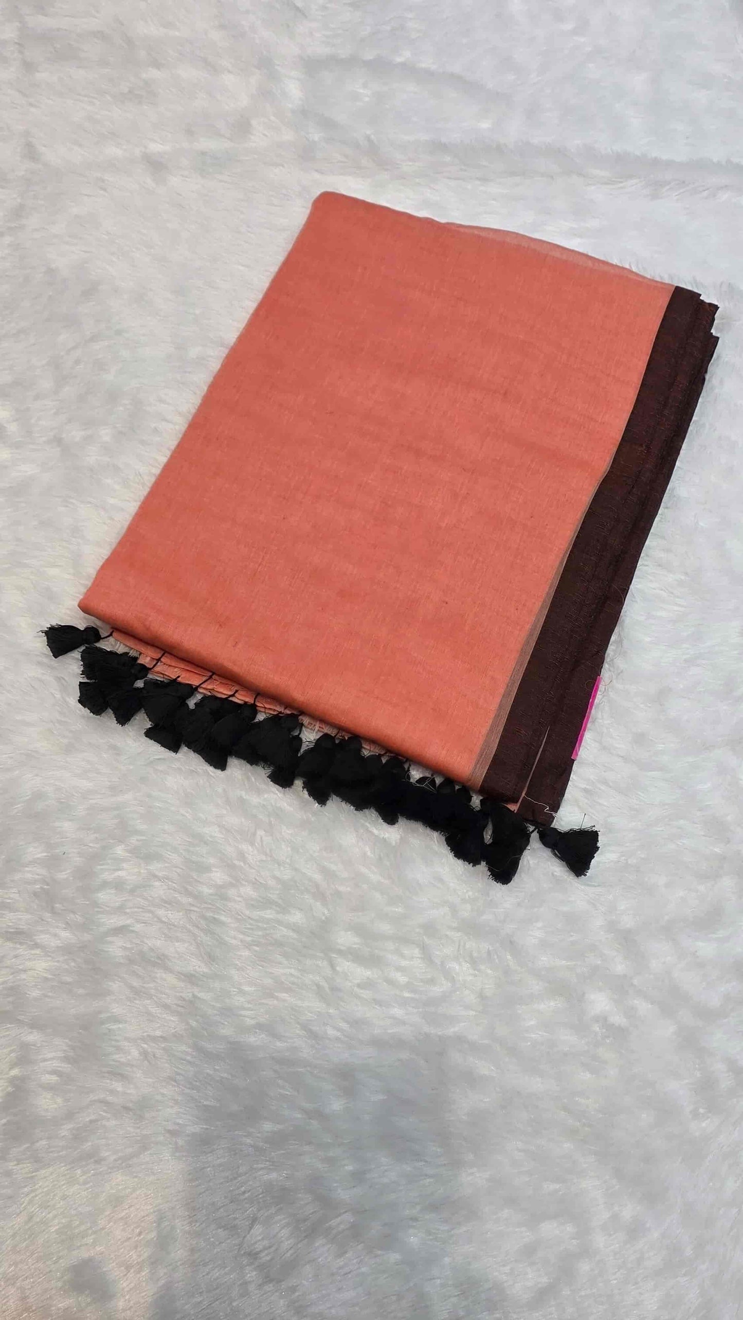 Soft mulmul cotton saree in dusty peach with solid black border